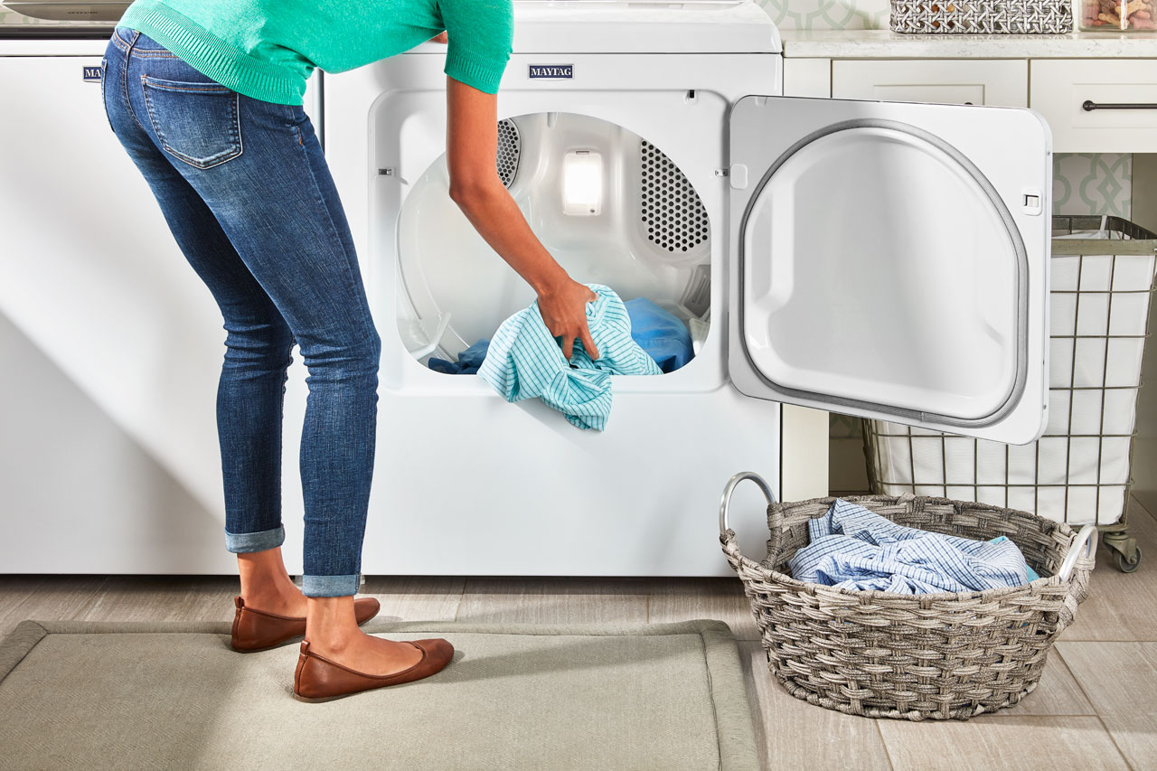 Maytag dryer, woman unloading laundry